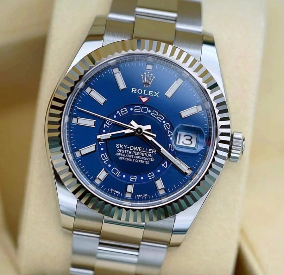 Rolex The Oyster Perpetual Sky-Dweller in White Rolesor with a bright blue dial and an Oyster bracelet. RLX Sky-Dweller RLX-DWELLER